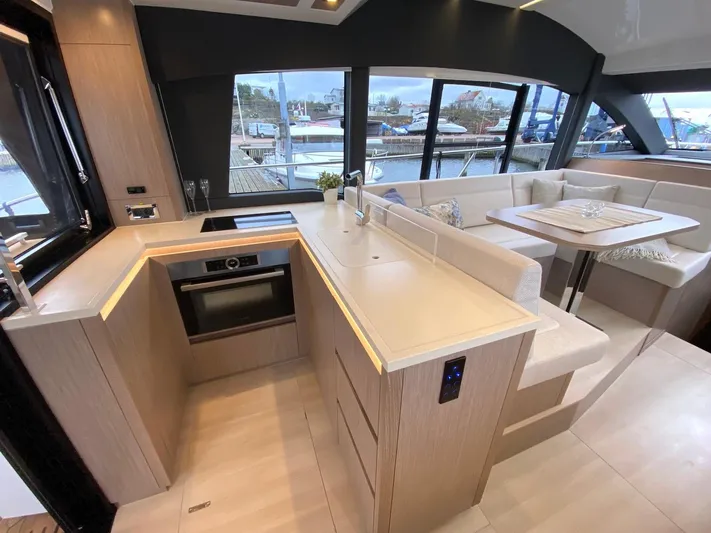 Sealine F430 Yacht Photos Pics Luxurious 2025 Sealine F430 yacht interior with modern kitchen and dining area.