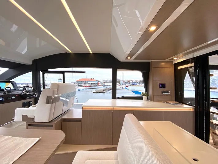 Sealine F430 Yacht Photos Pics Luxurious interior of 2025 Sealine F430 yacht with modern design and marina view.