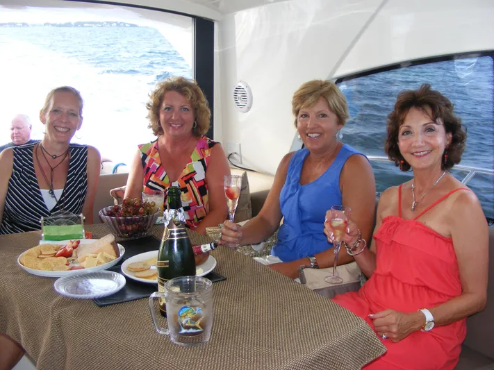  Yacht Photos Pics Women enjoying drinks and snacks on a 2012 Prestige 440S yacht.