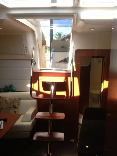  Yacht Photos Pics Interior of 2012 Prestige 440S yacht with wooden stairs and modern seating area.