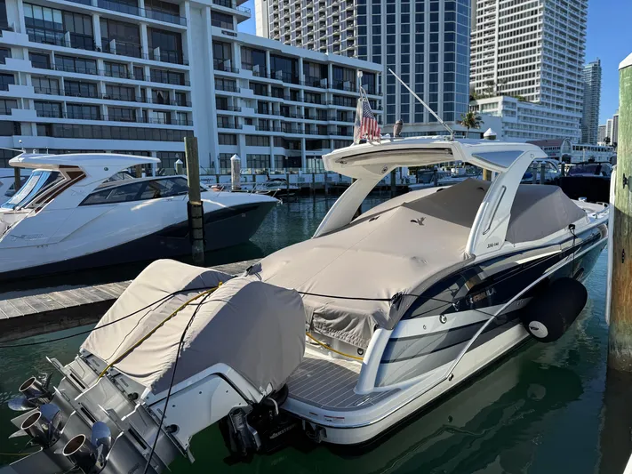 Sunny No Showers Yacht Photos Pics 2023 Formula 350 Crossover Bowrider OB docked in a marina, covered and secured.