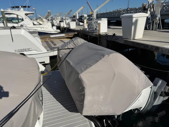 Sunny No Showers Yacht Photos Pics 2023 Formula 350 Crossover Bowrider OB docked with covered engines.
