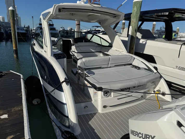 Sunny No Showers Yacht Photos Pics 2023 Formula 350 Crossover Bowrider OB docked, showcasing sleek design and spacious seating.