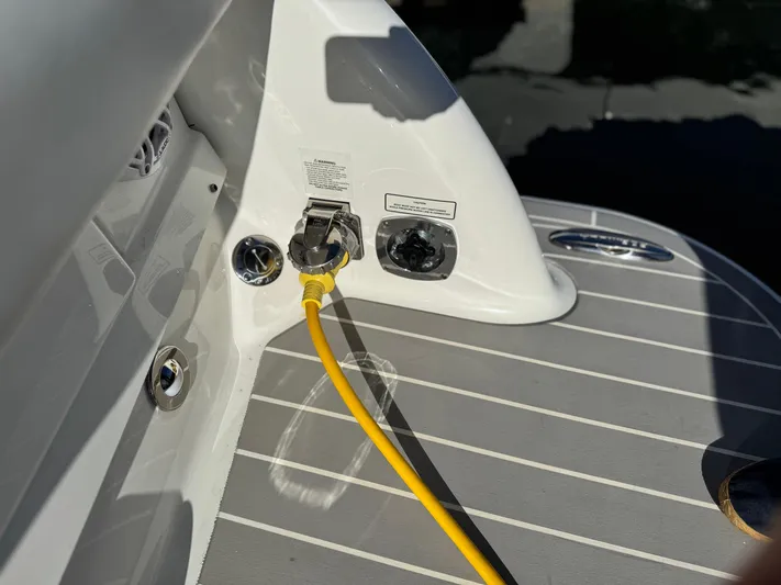 Sunny No Showers Yacht Photos Pics 2023 Formula 350 Crossover Bowrider OB with yellow power cable on deck.