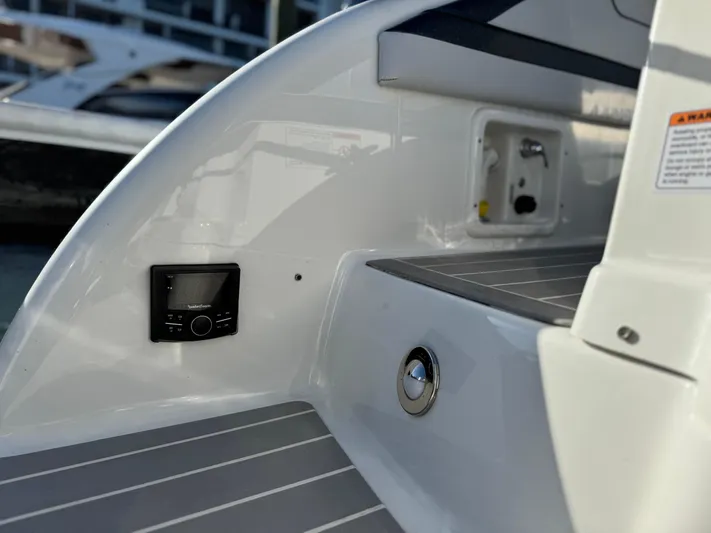 Sunny No Showers Yacht Photos Pics 2023 Formula 350 Crossover Bowrider OB, sleek interior detail with control panel.