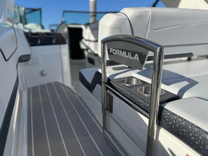 Sunny No Showers Yacht Photos Pics 2023 Formula 350 Crossover Bowrider OB interior with sleek seating and cup holders.