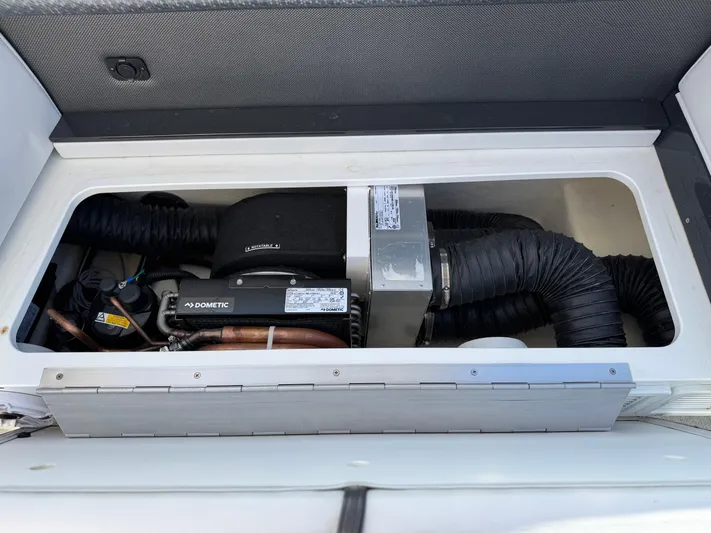 Sunny No Showers Yacht Photos Pics 2023 Formula 350 Crossover Bowrider OB engine compartment with visible components and wiring.