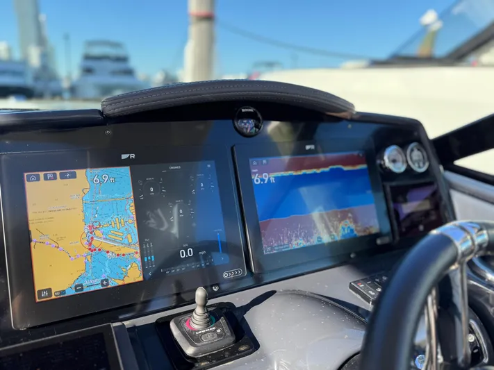 Sunny No Showers Yacht Photos Pics Dashboard of 2023 Formula 350 Crossover Bowrider OB with navigation screens.