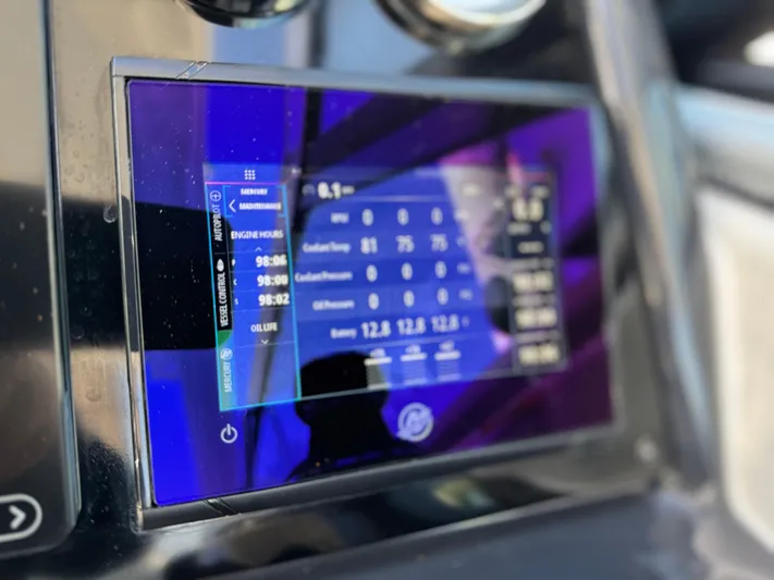 Sunny No Showers Yacht Photos Pics Touchscreen display on 2023 Formula 350 Crossover Bowrider OB boat dashboard.