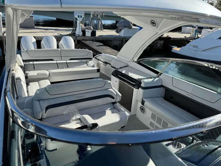 Sunny No Showers Yacht Photos Pics 2023 Formula 350 Crossover Bowrider OB with luxurious seating and sleek design at the dock.