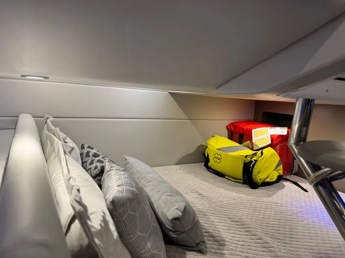 Sunny No Showers Yacht Photos Pics 2023 Formula 350 Crossover Bowrider OB cabin with pillows and bags.