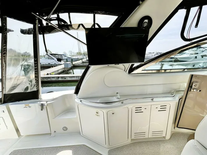  Yacht Photos Pics Interior of 2000 Sea Ray 410 Sundancer yacht with TV and storage cabinets.