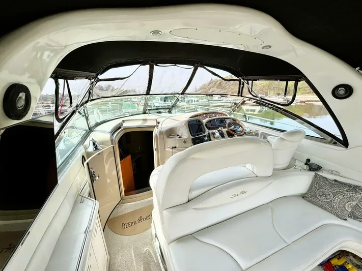  Yacht Photos Pics Interior view of a 2000 Sea Ray 410 Sundancer yacht, featuring a sleek cockpit design.