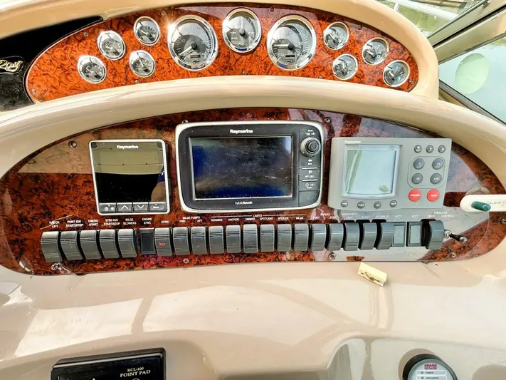  Yacht Photos Pics Control panel of a 2000 Sea Ray 410 Sundancer with navigation instruments and gauges.
