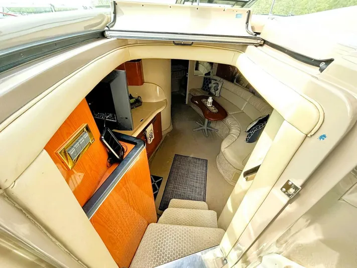  Yacht Photos Pics Interior view of 2000 Sea Ray 410 Sundancer yacht, featuring cozy seating and elegant design.