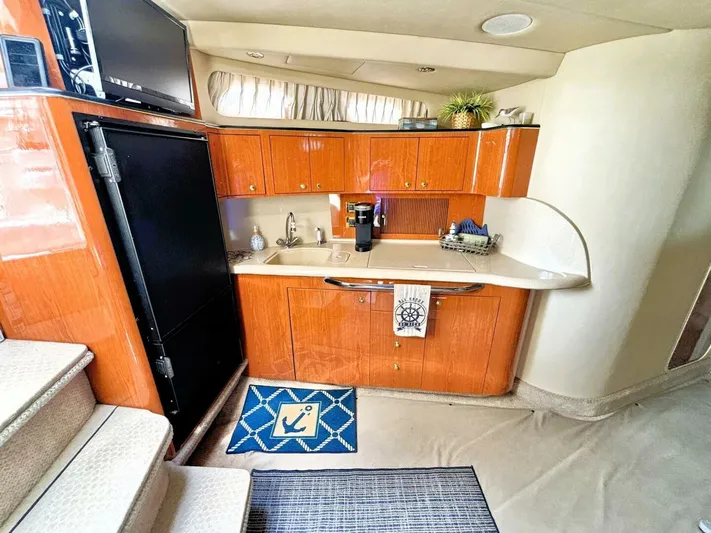  Yacht Photos Pics Interior of 2000 Sea Ray 410 Sundancer yacht with kitchenette and modern amenities.