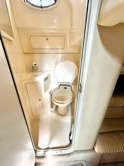  Yacht Photos Pics 2000 Sea Ray 410 Sundancer bathroom interior with compact design and modern fixtures.