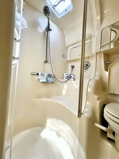  Yacht Photos Pics Bathroom interior of 2000 Sea Ray 410 Sundancer yacht, featuring shower and toilet.