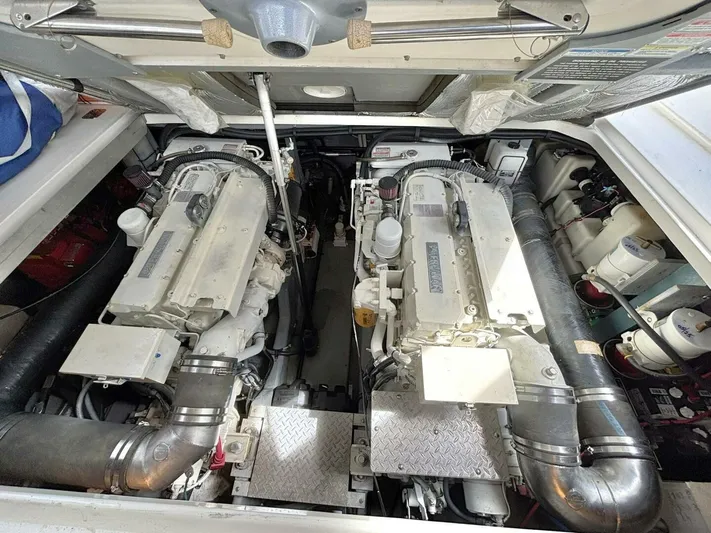  Yacht Photos Pics Engine room of a 2000 Sea Ray 410 Sundancer, featuring dual engines and mechanical components.