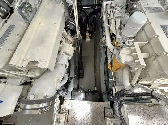  Yacht Photos Pics Engine room of a 2000 Sea Ray 410 Sundancer boat, showcasing dual engines.