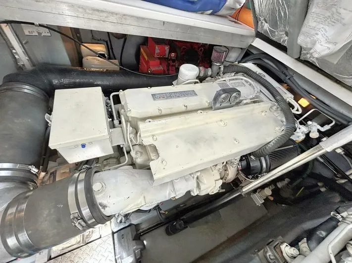  Yacht Photos Pics Engine compartment of a 2000 Sea Ray 410 Sundancer boat, showcasing mechanical components.