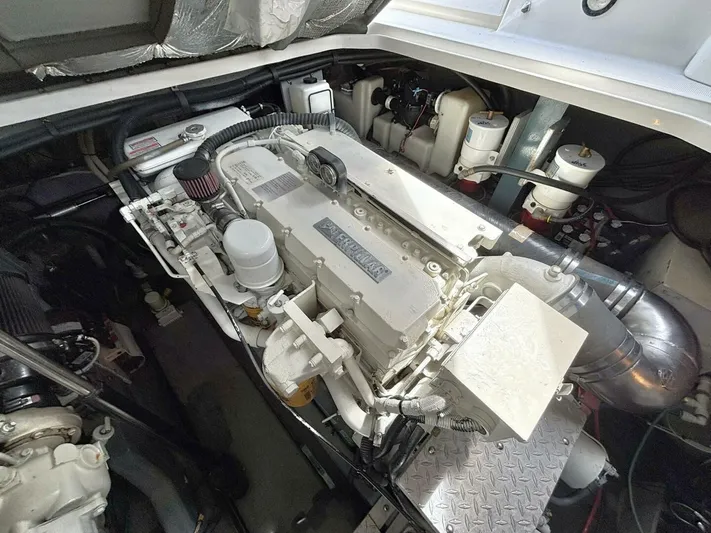  Yacht Photos Pics Engine compartment of a 2000 Sea Ray 410 Sundancer boat, showcasing detailed machinery.