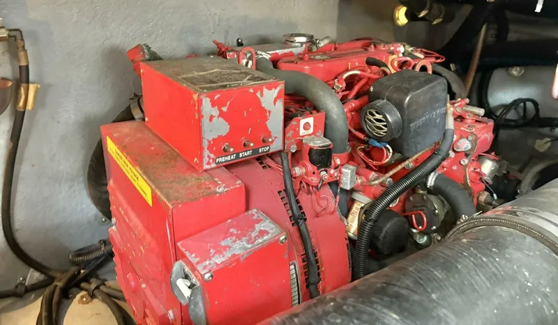  Yacht Photos Pics Engine compartment of a 2000 Sea Ray 410 Sundancer boat, featuring a red generator.