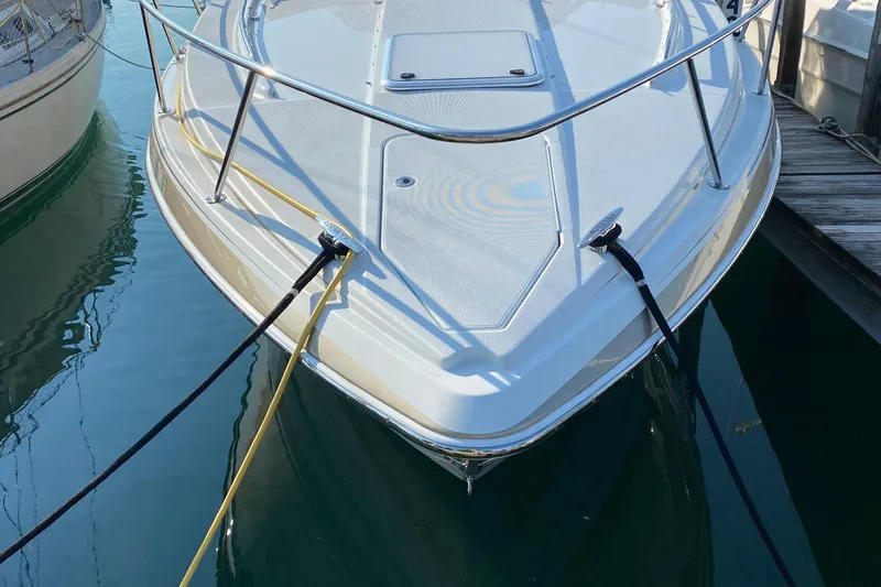 Calypso Yacht Photos Pics 2013 Formula 34 Performance Cruiser docked with ropes in calm water.