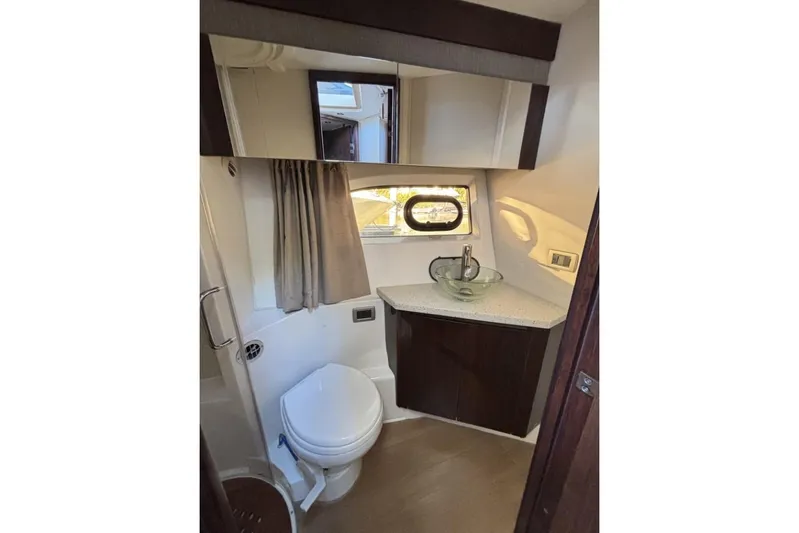 Seven Stars Yacht Photos Pics Luxurious bathroom in 2016 Sea Ray 400 Sundancer yacht with modern fixtures.