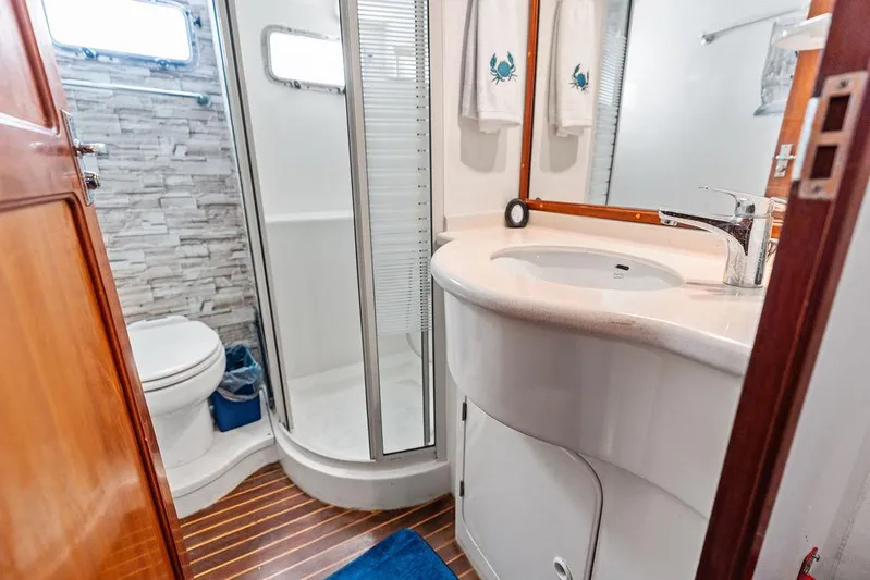  Yacht Photos Pics Modern yacht bathroom with shower, sink, and toilet in a 2000 Selene Solo.
