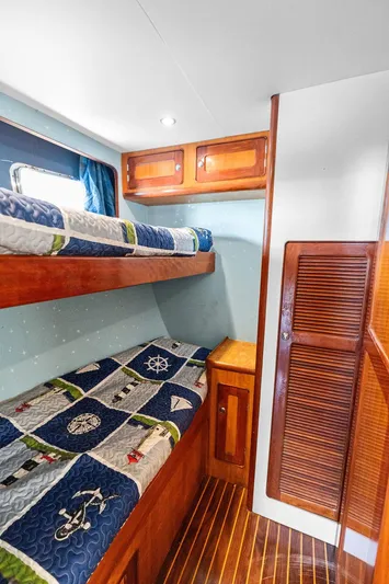  Yacht Photos Pics Bunk beds in a 2000 Selene Solo yacht cabin with nautical-themed bedding.
