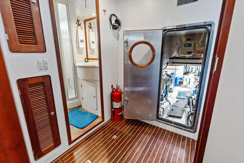  Yacht Photos Pics Engine room access on 2000 Selene Solo yacht, featuring wooden flooring and safety equipment.
