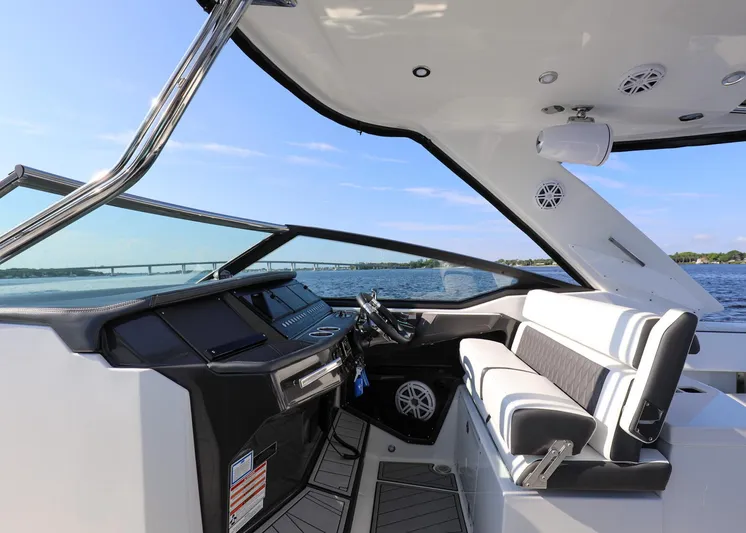  Yacht Photos Pics 2023 Monterey 385 Super Sport boat interior with sleek design and modern controls.