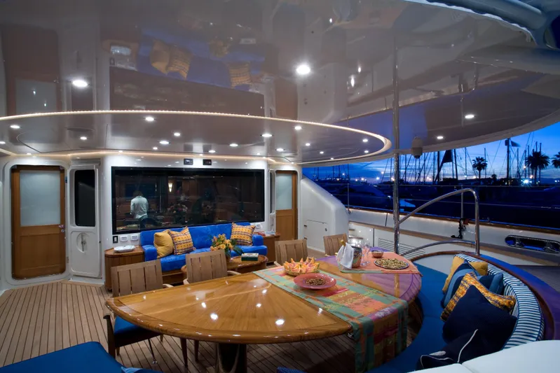 Tamsen Yacht Photos Pics Luxurious 2007 Perini Navi 52M yacht deck with elegant dining area at sunset.