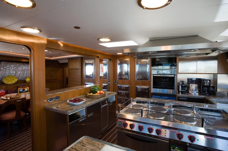 Tamsen Yacht Photos Pics Luxurious kitchen interior on 2007 Perini Navi 52M yacht, featuring modern appliances and elegant design.