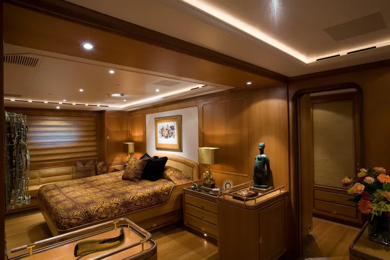 Tamsen Yacht Photos Pics Luxurious bedroom interior on 2007 Perini Navi 52M yacht, featuring elegant wood paneling and ambient lighting.