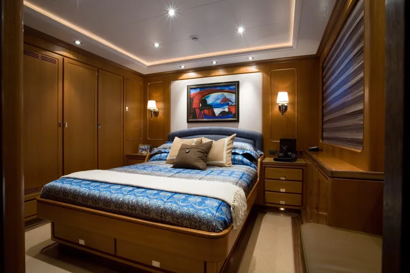 Tamsen Yacht Photos Pics Luxurious bedroom interior on 2007 Perini Navi 52M yacht, featuring elegant wood paneling and modern decor.