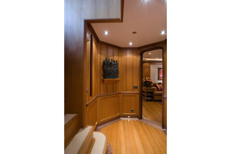 Tamsen Yacht Photos Pics Luxurious wooden interior of 2007 Perini Navi 52M yacht, featuring elegant decor and lighting.