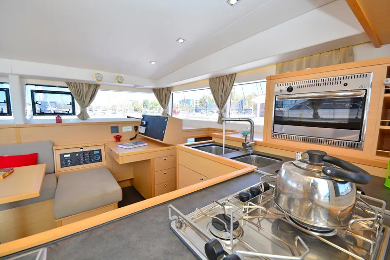  Yacht Photos Pics Interior of 2017 Lagoon 400 S2 yacht with modern kitchen and seating area.