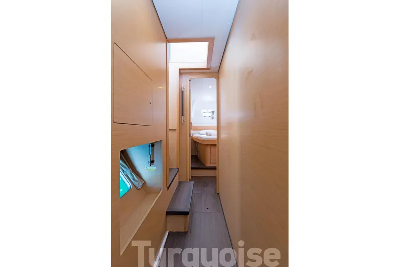  Yacht Photos Pics Interior hallway of 2017 Lagoon 400 S2 catamaran, featuring light wood paneling.