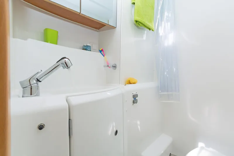  Yacht Photos Pics Bathroom interior of 2017 Lagoon 400 S2 yacht with modern fixtures.