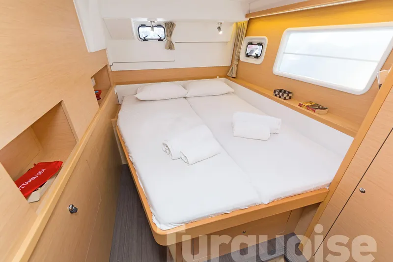  Yacht Photos Pics 2017 Lagoon 400 S2 yacht cabin with cozy bed, wooden interior, and natural light.