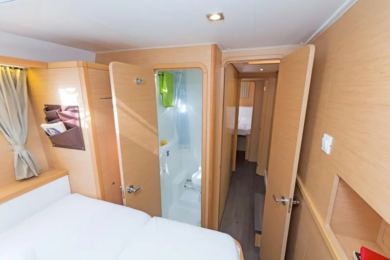  Yacht Photos Pics Interior of 2017 Lagoon 400 S2 yacht cabin with modern wood finish.