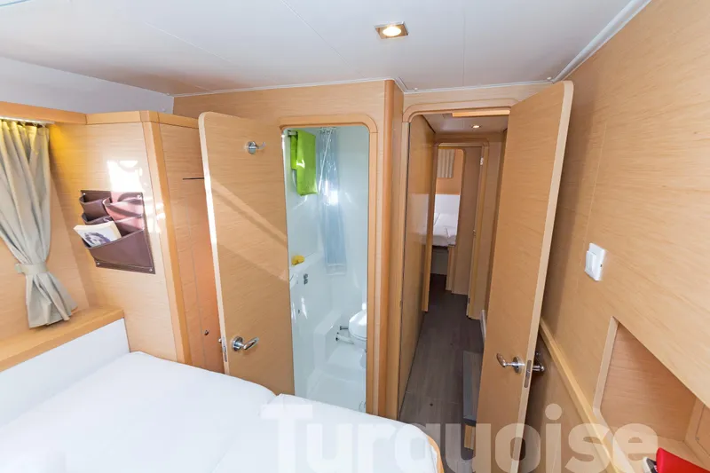  Yacht Photos Pics Interior of 2017 Lagoon 400 S2 yacht, featuring cozy cabin and modern bathroom.