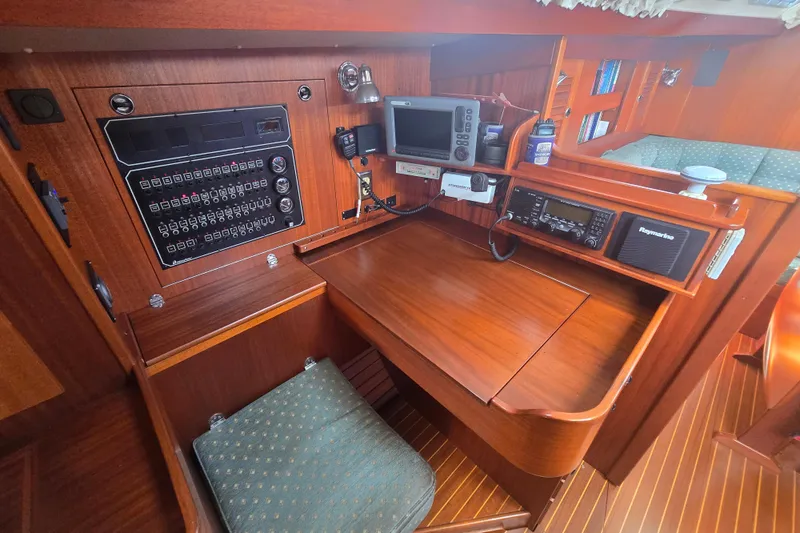 Georgia B Yacht Photos Pics Navigation station of 2000 Hallberg-Rassy 42F Mk II yacht with control panel and electronics.