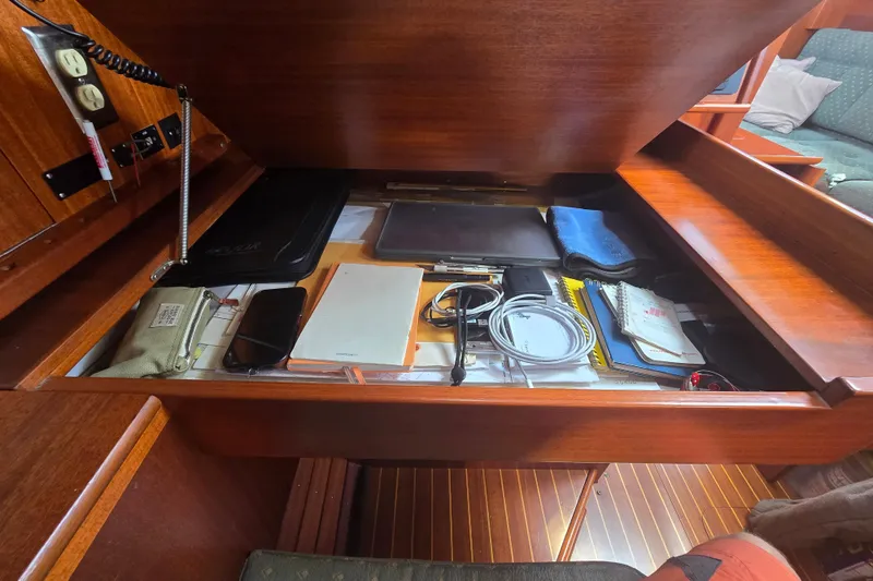 Georgia B Yacht Photos Pics Interior of 2000 Hallberg-Rassy 42F Mk II yacht with organized navigation desk.