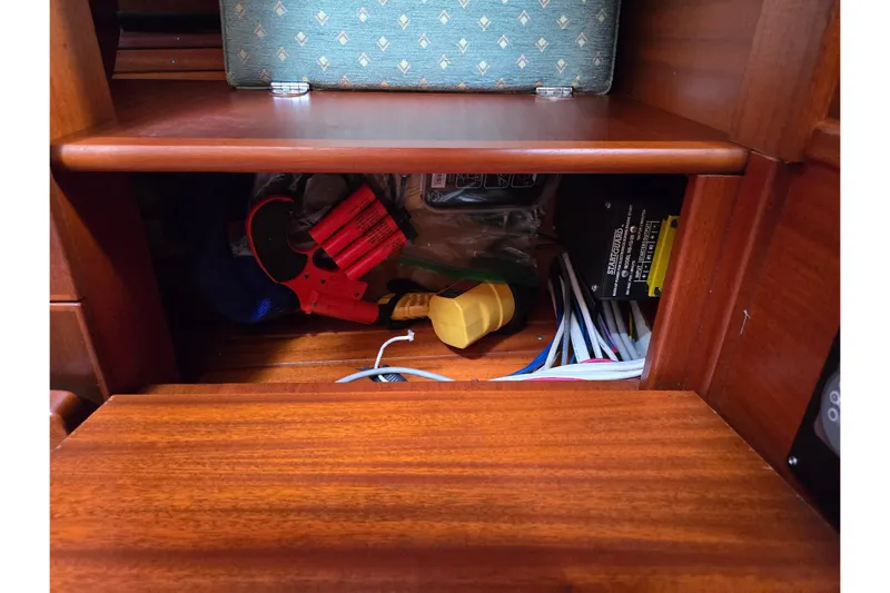 Georgia B Yacht Photos Pics Storage compartment in 2000 Hallberg-Rassy 42F Mk II yacht with tools and cables.