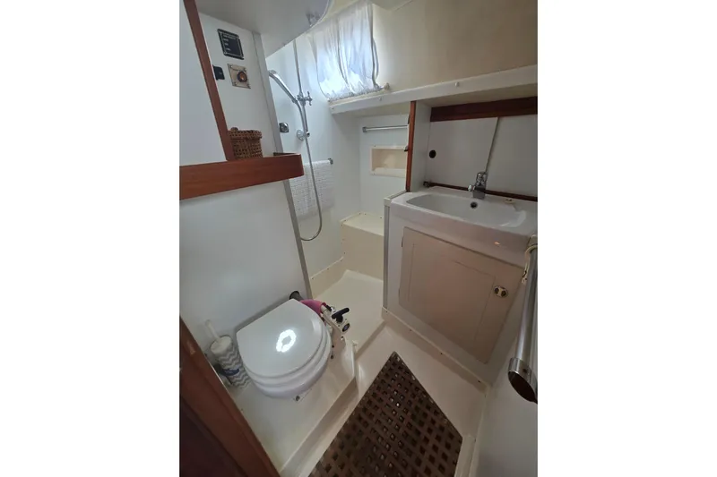 Georgia B Yacht Photos Pics Bathroom interior of 2000 Hallberg-Rassy 42F Mk II yacht, featuring shower and sink.