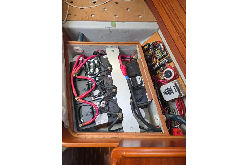 Georgia B Yacht Photos Pics Electrical system of a 2000 Hallberg-Rassy 42F Mk II yacht, featuring batteries and wiring.