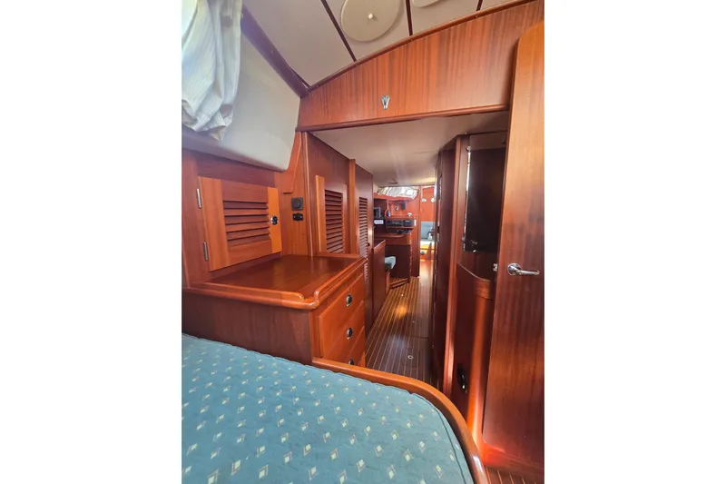 Georgia B Yacht Photos Pics Interior of 2000 Hallberg-Rassy 42F Mk II yacht, featuring elegant wood finish and cozy cabin.